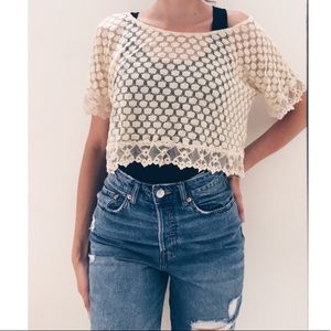 Yellow lace top paired with a black tank top